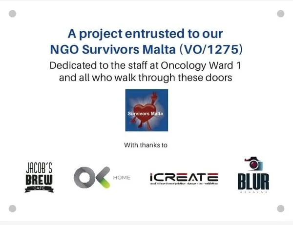 Plaque reading "A project entrusted to our NGO Survivors Malta (VO/1275) — dedicated to the staff at Oncology Ward 1 and all who walk through these doors", with thanks to Jacob's Brew Cafe, OK Home, iCreate and Blur Studios