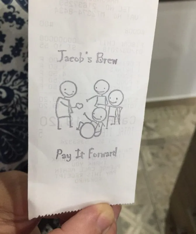 A Jacob's Brew receipt stamped with the pay it forward stamp